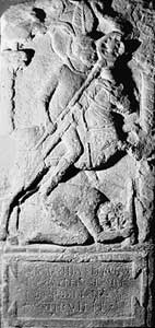 The tombstone of Flavinus, standard bearer 
                    of the cavalry unit the ala Petriana. The depiction 
                    of the cavalryman riding down a barbarian was a favoured tombstone 
                    relief for Roman auxiliary cavalry troopers